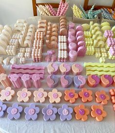 there are many different shapes and sizes of plastic beads on the table with other items