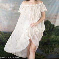 This delicate chiffon dress is as light and airy as a spring blossom in the wind. Embroidered with swiss dots and delicate florals, this whimsical fabric is like a Spring garden you can wear. Puff sleeves add a touch of vintage charm, while the elastic neckline offers versatility, allowing you to wear it on or off the shoulders. While the sheer fabric adds a hint of allure and romance, we recommend pairing this embroidered chiffon dress with a slip or bloomers for modesty if worn on its own. Thi Spring Daywear Swiss Dot Dresses, Spring Swiss Dot Dresses For Daywear, Feminine Swiss Dot Dress For Garden Party, Spring Swiss Dot Dress For Garden Party, Swiss Dot Dress For Spring Garden Party, Spring Swiss Dot Chiffon Dress, Whimsical Fabric, Embroidered Chiffon, Spring Blossom