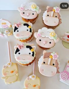 cupcakes decorated with farm animals and flowers