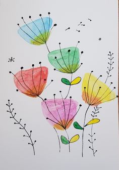 an art project with watercolors on paper and colored flowers in different colors,