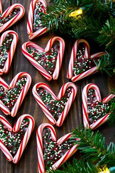 many candy canes are arranged in the shape of hearts