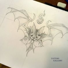 a pencil drawing of a dragon with wings and flowers on it's back side