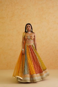 Vibrant multi-colored net fabric lehenga paired with a stylish brocade blouse, adding a touch of glamour to any occasion. Festive Multicolor Organza Pre-draped Saree, Designer Multicolor Lehenga With Zari Work, Multicolor Designer Dress With Dupatta, Designer Multicolor Dresses With Sheer Dupatta, Multicolor Semi-stitched Dress With Cutdana, Multicolor Dress With Sheer Dupatta For Festive Occasions, Festive Multicolor Dress With Sheer Dupatta, Multicolor Bollywood Dress With Cutdana, Fitted Multicolor Sets With Resham Embroidery