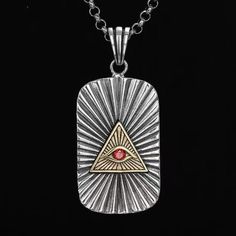 The Eye Of Providence Necklace is a remarkable piece of jewelry crafted with high-quality material, ensuring its durability and longevity. The pendant features the iconic Eye Of Providence symbol, also known as the all-seeing eye, with intricate detailing and engraving. Whether worn for formal events or casual occasions, this Eye Of Providence Necklace is a prized possession that symbolizes strength, power, and enlightenment. We ship worldwide to 185 countries! Please allow 1-2 business weeks fo Red Symbolic Engraved Jewelry, Red Spiritual Engraved Necklace, Red Engraved Amulet Necklace, Red Engraved Spiritual Necklaces, Red Engraved Spiritual Necklace, Symbolic Red Pendant Necklace, Red Rectangular Spiritual Jewelry, Spiritual Red Rectangular Jewelry, The Eye Of Providence