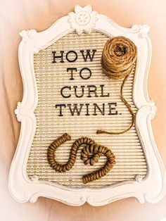 a sign that says how to curl twine on the side of a white frame