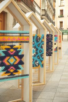 a row of wooden frames with different designs on them