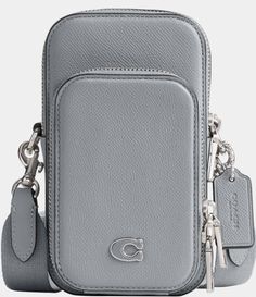 From COACH, the Silver Hardware Phone Crossbody Bag features: Cross grain leather and signature coated canvasOne credit card slotZip closureFabric liningOutside zip pocketDetachable strap with approx. 25" drop for shoulder or crossbody wearApprox.: 4" L x 7" H x 2.5" WImported. Dillard's, Phone Bag, Global Fashion, 7 H, Silver Hardware, Creative Director, Zip Pockets, Crossbody Bag, Grain