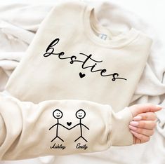 Personalized Besties Hoodie with Name on Sleeve For Best Friends, Matching Besties Trip Crewneck, Cute Birthday Gift For Friend,Gift For Her,  990 -If you would like any other color of t-shirt, sweatshirt, hoodie, etc., please let me know by sending a message. I will provide it for you. ----------- How to Order Your Custom Design T-shirt ---------- * Choose your t-shirt color * Choose your size * PLEASE make sure all your order's steps Unisex Soft-Style T-shirt The unisex soft-style t-shirt puts Matching Best Friend Sweaters, Bff Hoodies For 2, Hoodies For Best Friends, Matching Clothes For Best Friends, Matching Hoodies For Best Friends, Matching Best Friend Hoodies, Bff T Shirts, Bestie Hoodies, Sister Hoodies