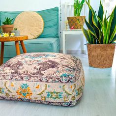 a living room filled with furniture and potted plants