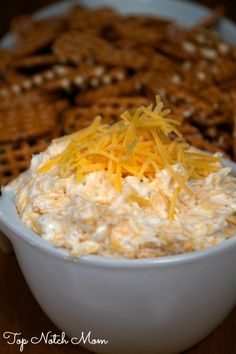 a white plate topped with cheese and crackers