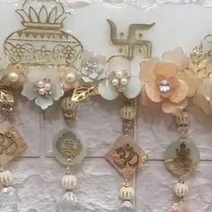 the wall is decorated with many different types of brooches and flowers on it