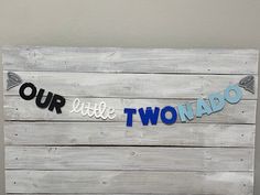 a wooden sign that says our little two hado