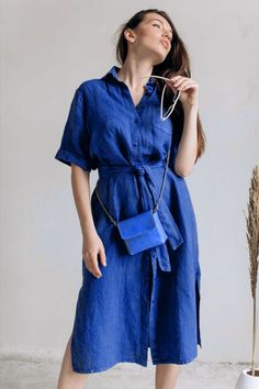 Elevate your wardrobe with linen shirt dress, perfect for any casual occasion. Made from high-quality linen, this dress offers both comfort and breathability, with a straight original fit that flatters the body. The dress features half sleeves, a midi length, and a single pocket, adding a practical touch to its stylish design. The included belt cinches the waist, creating a flattering silhouette. The dress also features a side slit, adding a touch of elegance and allowing for ease of movement. Shirt Dress For Women, Button Down Midi Dress, Loose Shirt Dress, Dress With Buttons, Cottagecore Dress, Linen Shirt Dress, Midi Dress Casual, Loose Outfit, Women Midi