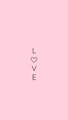 the word love is written in black on a pink background with a small white heart