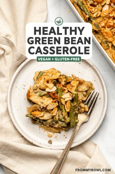 healthy green bean casserole on a white plate with a fork next to it