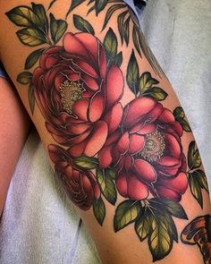 a woman's thigh with flowers on it