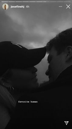 a man and woman kissing each other in front of a cloudy sky with the words love is