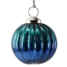 a blue glass ornament hanging from a chain