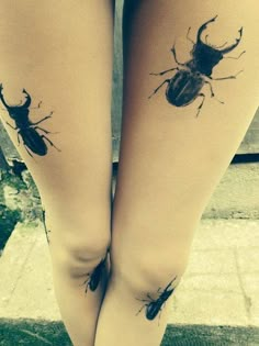 two legs with tattoos on them that look like bugs