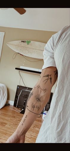 a man with a tattoo on his arm