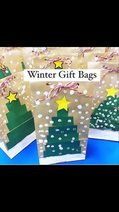 three bags with christmas trees on them and the words winter gift bags written in white