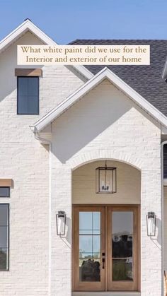 a white brick house with an advertisement on the front door that says what everything else does for the interior and exterior of our home