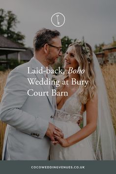 a man and woman standing next to each other with the words laid back boho wedding at bury court barn