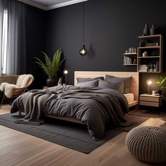 a bedroom with black walls and wooden flooring has a large bed, two chairs, and a plant in the corner