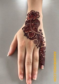 a henna tattoo is shown on someone's hand