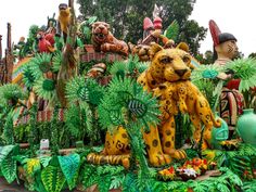 an elaborately decorated float with animals and plants