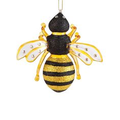 a yellow and black bee ornament hanging from a chain