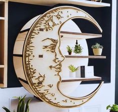 a wooden wall clock with a crescent moon on it