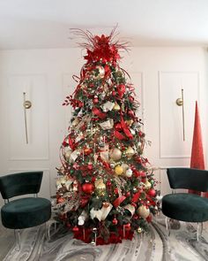 a decorated christmas tree with red and gold ornaments