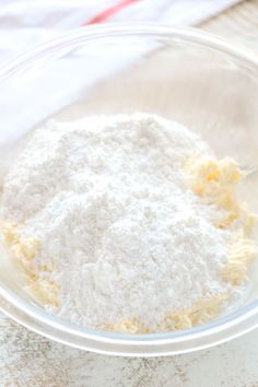 a bowl filled with flour on top of a table