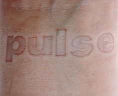 the word pulledess written on someone's wrist