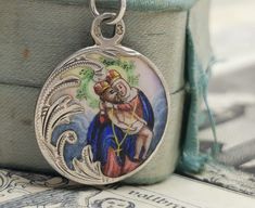 A magnificent antique silver enamel Pieta medal, petite Austrian enamel amulet on a 16 inch long sterling chain, rare Virgin Mary Catholic charm, very nicely done, in good condition, ideal for strength and protection necklace, would make a nice gift for someone special! Comes with approx. 16 inch long 925 silver necklace (see photo 5)! Material: solid silver, enamel total weight: 6.6g Measures: approx. 22 mm (0.8 inch) in diameter A stunning religious jewelry shop well worth a visit ... https:// Antique Miraculous Medal Necklace As Gift, Antique Enamel Necklace Hallmarked, Silver Medallion Necklace Souvenir, Silver Medallion Necklace As Souvenir, Antique Enamel Necklace With Hallmark, Silver Medallion Necklace For Souvenirs, Antique Enamel Hallmarked Necklaces, Silver Medallion Jewelry As Souvenir, Silver Medallion Jewelry For Souvenirs