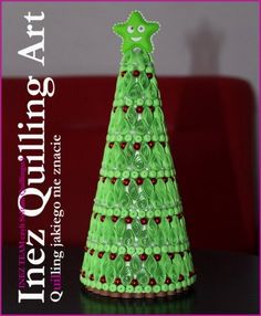 a green christmas tree made out of rolled paper