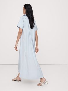 We reimagined the timeless kaftan silhouette with wide sleeves and slits at the side hem to show a little leg.  Here, we've cut this dress in our signature cotton poplin.  Relaxed fit with dropped shoulder.  Long, wide sleeves.  Deep v-neck with collar.  On-seam pockets.  Straight hem with high, side slits.  Unlined.  *This dress runs oversized.  Consider sizing down.  Relaxed fit.  Short sleeves.  Maxi length.  Model: Size S, 5'10" (178cm).  *This dress runs oversized.  Consider sizing down. Relaxed Fit Maxi Shirt Dress For Daywear, Spring Workwear Maxi Dress With Side Slits, Cotton Maxi Length Shirt Dress For Daywear, Cotton Maxi Shirt Dress For Daywear, Spring Midi Dress With Relaxed Fit And Side Slits, Spring Midi Dress With Side Slits And Relaxed Fit, Spring Cotton Midi Dress With Side Slits, Relaxed Fit Cotton Maxi Dress For Daywear, Long Midi Dress With Side Slits For Daywear