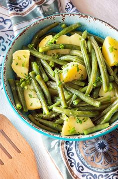 green beans and potatoes in a blue bowl