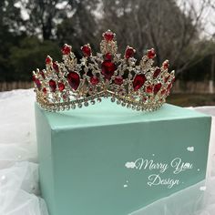 a tiara sitting on top of a box in the snow