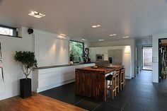 the kitchen is clean and ready to be used as a dining room or office area