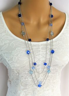 "Long Blue Beaded Necklace handmade by Ralston Originals. This blue beaded necklace has 3 long multi strands of beaded chains, with light and dark blue acrylic beads, and silver acrylic beads. The acrylic beads make this necklace lightweight and comfortable. This necklace is great with jeans or dresses. One of my best sellers. This blue necklace is 36 inches long, is made with silver metal chain, and has a lobster clasp. This Blue Beaded Necklace is ready to send to you today, it includes free s Necklaces Blue, Red Beaded Necklaces, Gray Necklace, Blue Beaded Necklace, Long Silver Necklace, Handmade Beaded Necklaces, Purple Necklace, Black Bead Necklace, Red Necklace