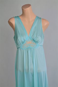 "Beautiful mint, pale green lingerie gown by LORRAINE in a size Small. Perfect honeymoon lingerie with Peekaboo Fitted Bodice Waist and V neckline. This Lingerie Mirrors Full sweep Olga Lingerie in style. by Lorraine size Small please follow measurements for desired fit: measurements laying flat: armpit to armpit up to 18\" under bust up to 17.5\" waist up to 21\" hip up to 23.5\" top shoulder to bottom hem line 53.5\" Fabric: nylon tricot made in USA Excellent vintage condition **Moviestarmoon Green Camisole For Bedtime, Sheer Sleeveless Green Sleepwear, Green Sheer Sleeveless Sleepwear, Green Peekaboo, 1970s Clothing, Perfect Honeymoon, Lingerie Gown, Green Lingerie, Honeymoon Lingerie