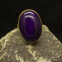 Handcrafted Purple Jade Ring | 24K Gold Plated 925 Sterling Silver | Greek Style Ring | Oval Cabochon Gemstone | Gift For Her Our shop offer free ring sizingHandcrafted hammered  ring Metal : 925 Sterling SilverPlating : 24K GoldBand Width : 3 mmGem Stone : Jade Gem Size : 25 X 18 mmRing Weight : 11.1 gramsRing Size : US 6 (The size you want is made for free).(We used the US standard sizing) **Custom Orders is Made**As pellada family, we will be happy to help you if you contact us with the photo Gold Amethyst Ring With Large Stone As Gift, Gold Oval Amethyst Cabochon Ring, Handmade Gold Oval Amethyst Ring, Oval Cabochon Amethyst Ring Gift, Cabochon Amethyst Ring Gift, Hammered Jewelry, Green Emerald Ring, Hammered Ring, Purple Jade