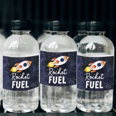 four bottles of water with rocket fuel labels on them