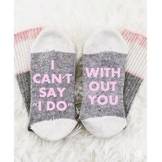 two pairs of socks with the words maid of honor written on them sitting on a fluffy white surface