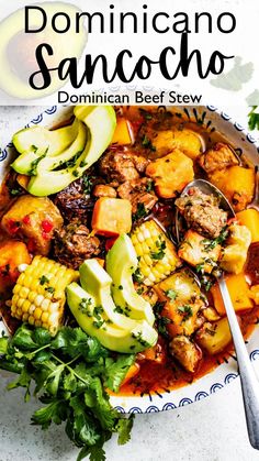 a bowl filled with meat and vegetables on top of a white tablecloth next to a spoon