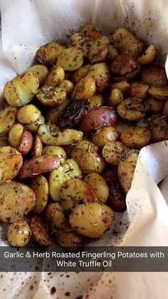 garlic and herb roasted fingerling potatoes with white truffle oil in a paper bag