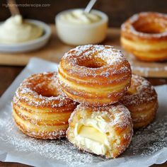 powdered sugar covered doughnuts with butter on top