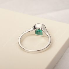 All HANDMADE ITEMS SHIP IN APPROX 8 DAYS Main Stone: Lab created emerald Main Stone Size: cushion cut 6 mm x 6 mm Main Stone Weight: 0.98 carat Side Stone: None Height From The Ring Setting Bottom(to gemstone top): about 4.43 mm Width of Ring band Measure: gradually varied,about 2.28 to 2.3 mm Material: 925 Sterling Silver/14K White Gold/14K Yellow Gold/14k Rose Gold Engraved: Available For FreeNo more than 13 letters) Customized:Of course! Tell me what you want Includes With Order: All of my st Minimalist Emerald Cut Birthstone Ring With Bezel Setting, Emerald Ring With Bezel Setting In Sterling Silver, Silver Emerald Ring With Bezel Setting For Promise, Silver Cushion Cut Ring With May Birthstone, Minimalist Emerald Ring With Bezel Setting For Anniversary, White Gold Sterling Silver Emerald Ring With Bezel Setting, Silver Cushion Cut Ring For May Birthstone, Asscher Cut Emerald Ring In Sterling Silver For Anniversary, Silver Emerald-cut Birthstone Ring With Bezel Setting